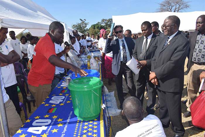 The Guests led by the Deputy Minister of Agriculture, Irrigation and Water Development, Hon. Aggrey Masi MP (Guest of Honour) appreciating the displays in the pavilions mounted by Oxfam, CHC, GIZ, FTC, WFP and Salima District Council on Nutrition and Food Security and other related disaster issues during a SUN project launch at Katelera Primary School Ground in Salima The Guests led by the Deputy Minister of Agriculture, Irrigation and Water Development, Hon. Aggrey Masi MP (Guest of Honour) appreciating the displays in the pavilions mounted by Oxfam, CHC, GIZ, FTC, WFP and Salima District Council on Nutrition and Food Security and other related disaster issues during a SUN project launch at Katelera Primary School Ground in Salima
