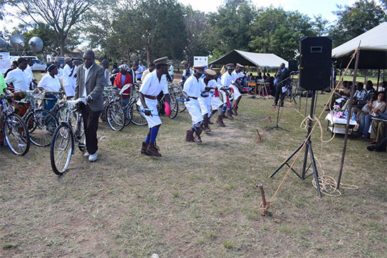 Village Mediators with their newly received bicycles posing in front of the Guests as a traditional dance performs in welcoming the launched Access to Justice Intervention Village Mediators with their newly received bicycles posing in front of the Guests as a traditional dance performs in welcoming the launched Access to Justice Intervention