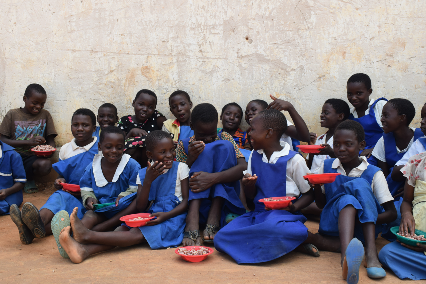 Students at Ishalikira Primary School happily eating nutritious meal at school